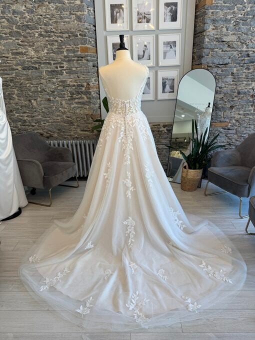 Luka a plus size lace aline wedding dress with a notched neckline and pockets.
