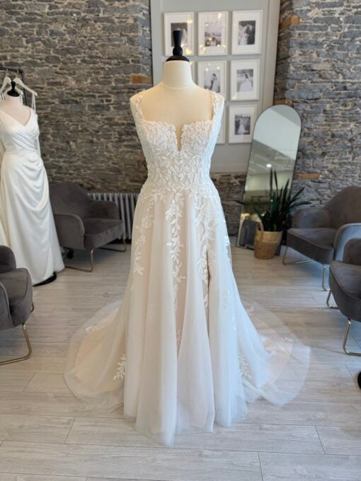 Luka a plus size lace aline wedding dress with a notched neckline and pockets.