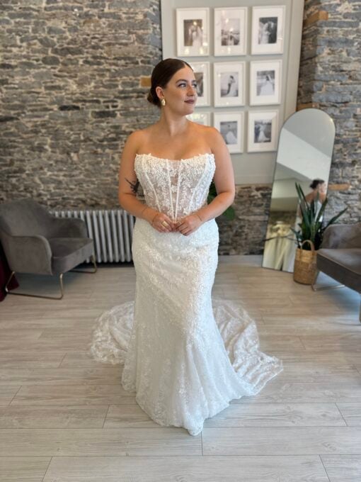 Lawrence, a sparkly fitted wedding dress with a subtle cat eye neckline