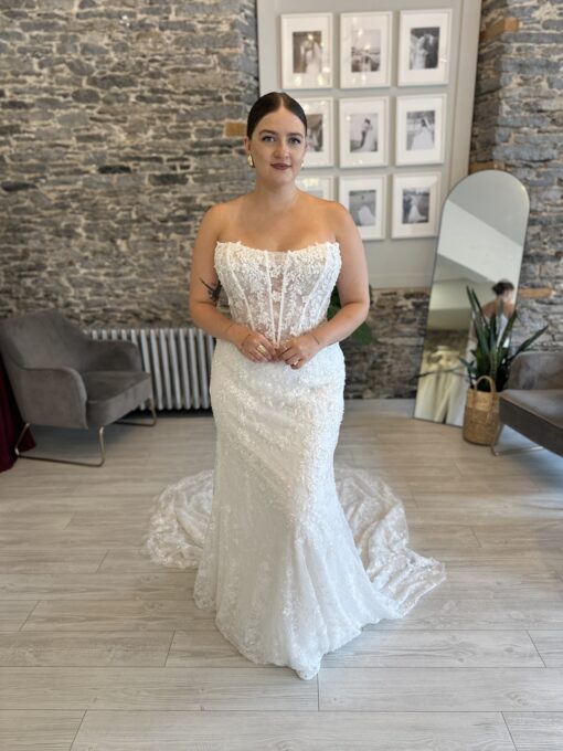 Lawrence, a sparkly fitted wedding dress with a subtle cat eye neckline