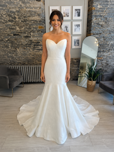 Lydia brocade fit and flare wedding dress on a bride at Runway Bridal