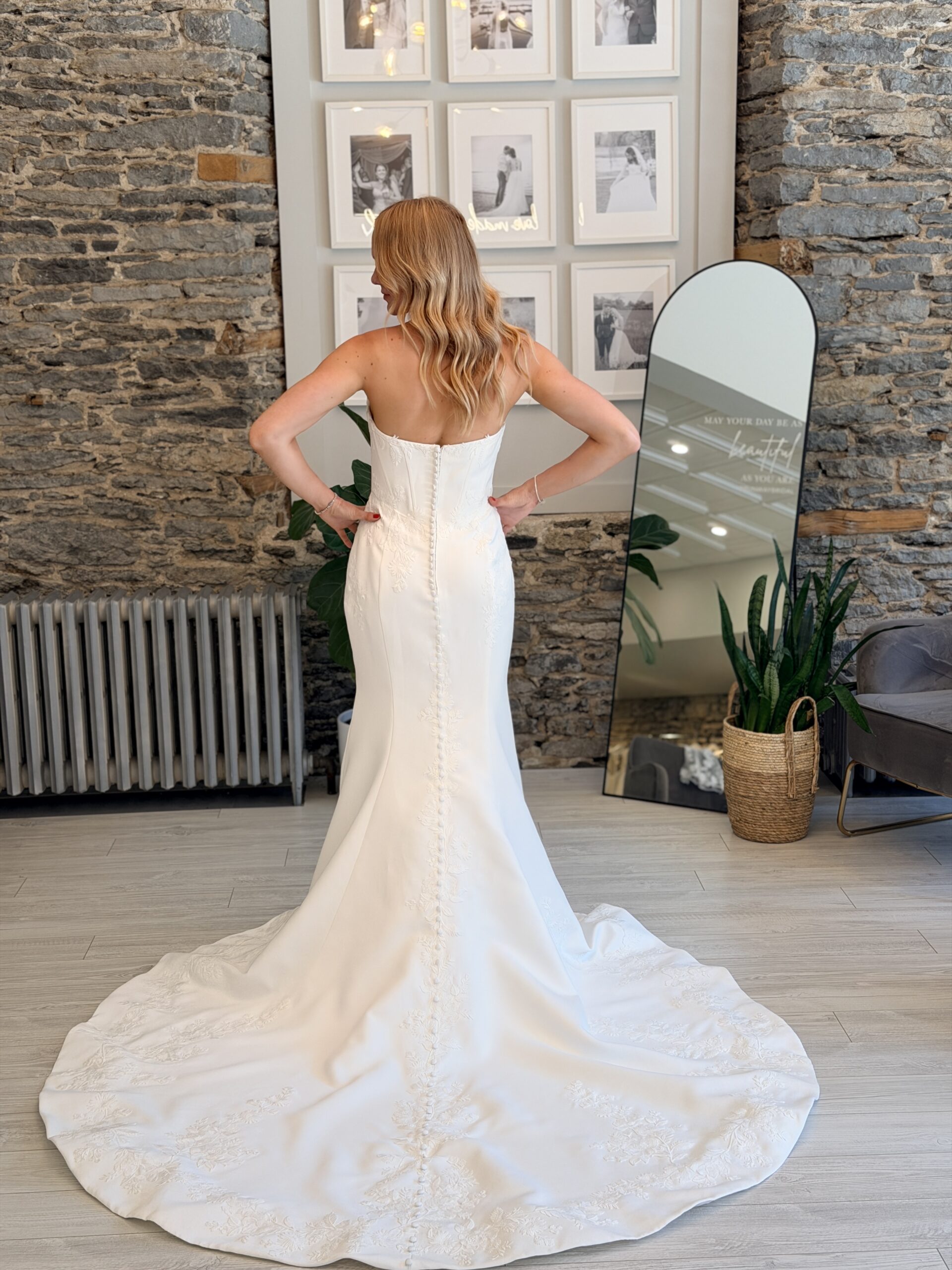 Leilani wedding dress, fitted matte satin with floral lace detail.