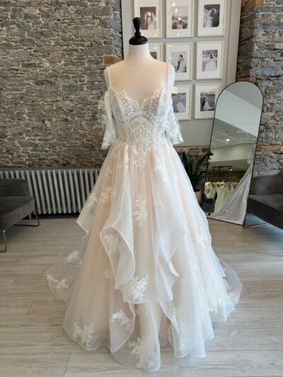 Lainey a ruffle skirt wedding dress with lace detailing
