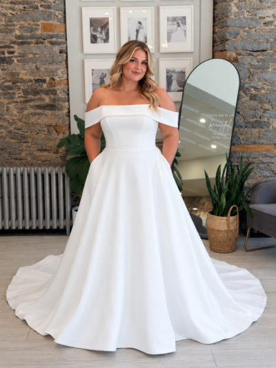 Romy wedding dress on a plus size model at Runway Bridal